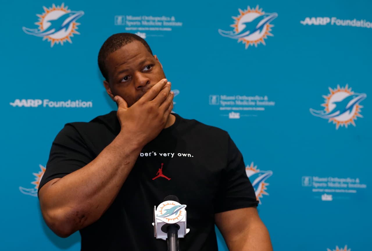 Miami Dolphins defensive tackle Ndamukong Suh gestures as he speaks during a news conference after an NFL organized team activities football practice, Tuesday, May 23, 2017, at the Dolphins training facility in Davie, Fla. (AP Photo/Wilfredo Lee)