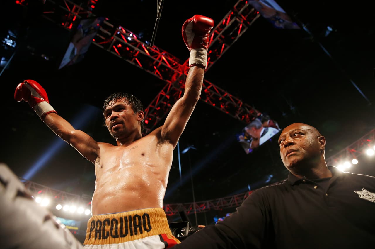 LAS VEGAS, NEVADA - APRIL 09: Manny Pacquiao celebrates after defeating Timothy Bradley Jr. by unanimous decision in their welterweight championship fight on April 9, 2016 at MGM Grand Garden Arena in Las Vegas, Nevada. (Photo by Christian Petersen/Getty Images)