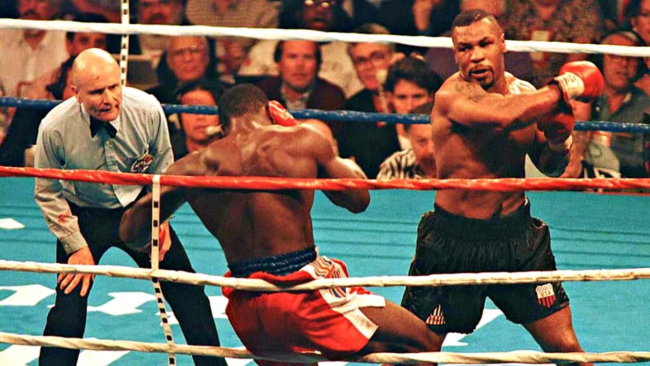 Michael Gerard Tyson o, Mike Tyson, nació en Brooklyn en 1966. Lo catalogaron como el boxeador más temido, más feroz, y de los mejores pesos pesados de la historia del boxeo. Fue campeón de los tres cinturones mundiales: WBA, WBC e IBF. Mike vivió excesos, dilapidó fortuna, fue encarcelado, denunciado por violación y una de sus parejas llegó a juzgarlo como un “maniaco depresivo”.
