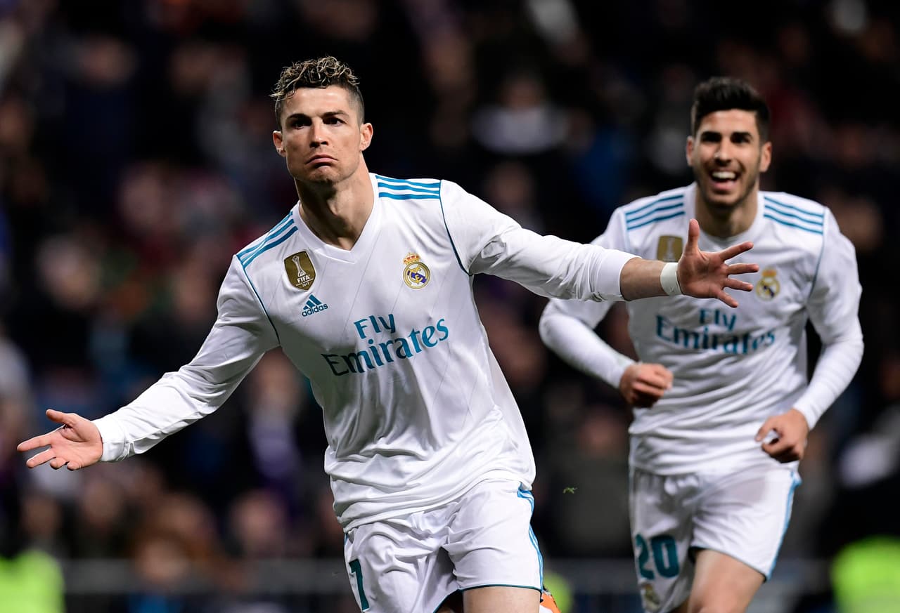 Real Madrid's Portuguese forward Cristiano Ronaldo celebrates a goal during the Spanish League football match between Real Madrid CF and Girona FC at the Santiago Bernabeu stadium in Madrid on March 18, 2018. / AFP PHOTO / JAVIER SORIANO (Photo credit should read JAVIER SORIANO/AFP/Getty Images)