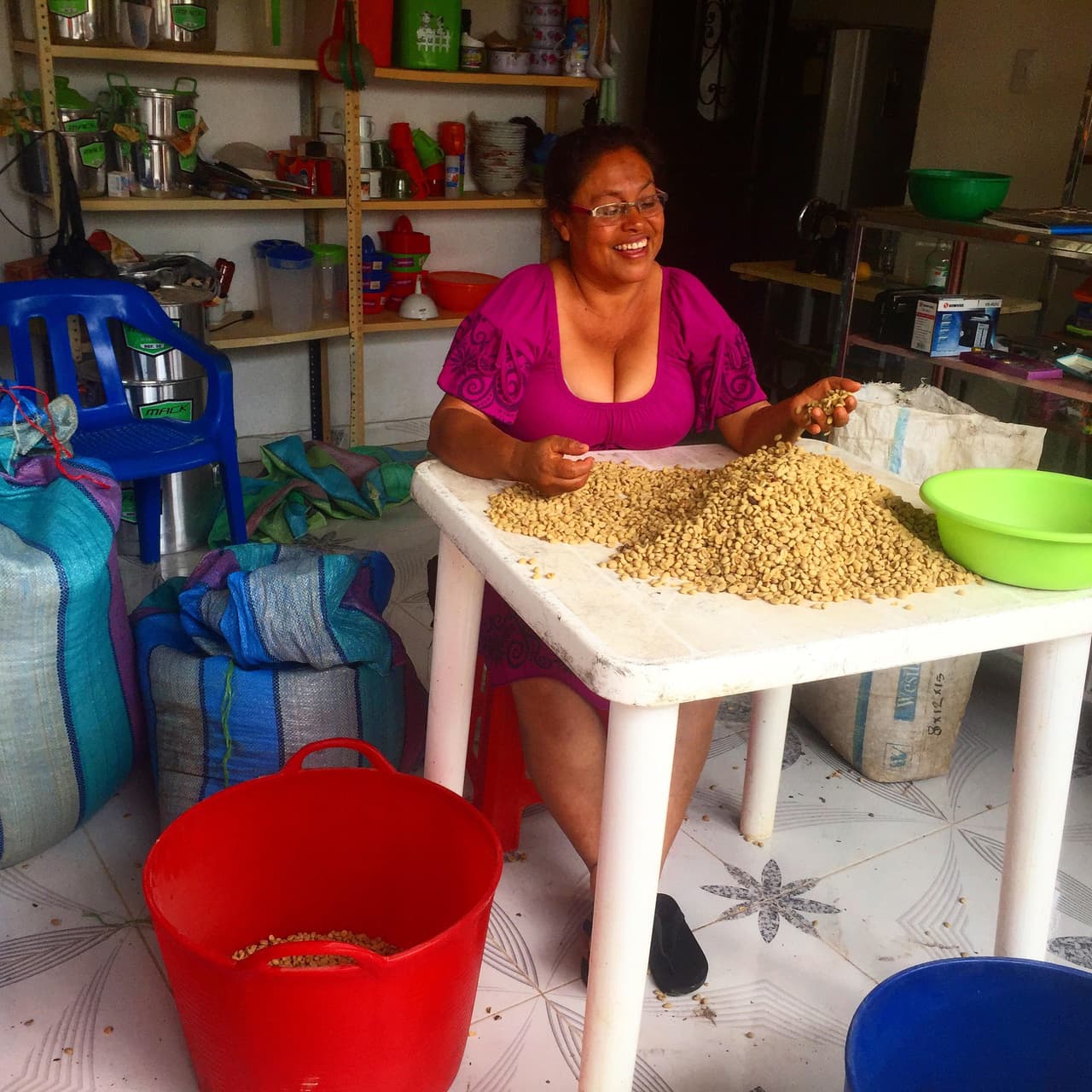 A Madrigales local, "Aura" displays her batch of coffee. She is separating the good goods that will then be roasted. Although this is purely for personal consumption, Aura seemed hopeful that Madrigales could export its "excellent" coffee. Photo by Maximo Anderson.
