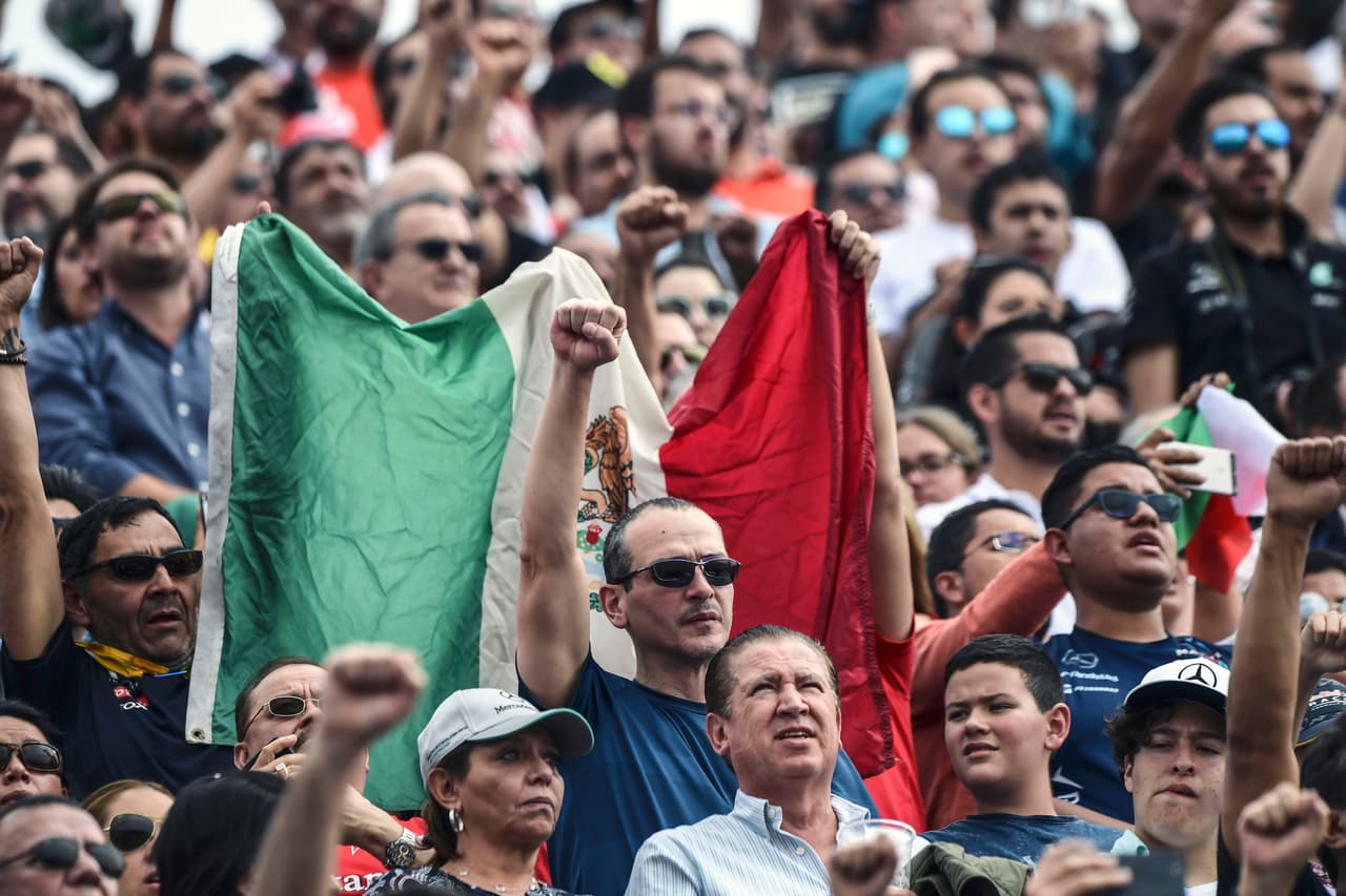 Mexican fans raise their clenched fists in tribute to the victims of September 19th quake, during the Formula One Mexico Grand Prix race at the Hermanos Rodriguez circuit in Mexico City on October 29, 2017. / AFP PHOTO / RONALDO SCHEMIDT (Photo credit should read RONALDO SCHEMIDT/AFP/Getty Images)