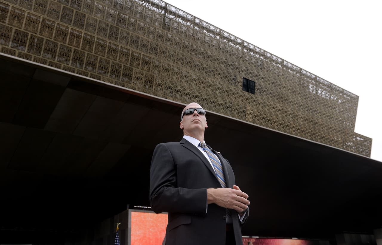 WASHINGTON, DC - SEPTEMBER 24: A secret servive agent stands still during the opening ceremony of the Smithsonian National Museum of African American History and Culture on September 24, 2016 in Washington, DC. The museum is opening thirteen years after Congress and President George W. Bush authorized its construction. (Photo by Olivier Douliery-Pool/Getty Images)