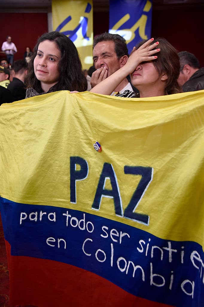 Colombians reacts in dejection after knowing the results of a referendum on whether to ratify a historic peace accord to end a 52-year war between the state and the communist FARC rebels, in Bogota, Colombia, on October 2, 2016. Colombian voters rejected a peace deal with communist FARC rebels Sunday, near-complete referendum results indicated, blasting away what the government hoped would be a historic end to a 52-year conflict. / AFP / GUILLERMO LEGARIA (Photo credit should read GUILLERMO LEGARIA/AFP/Getty Images)