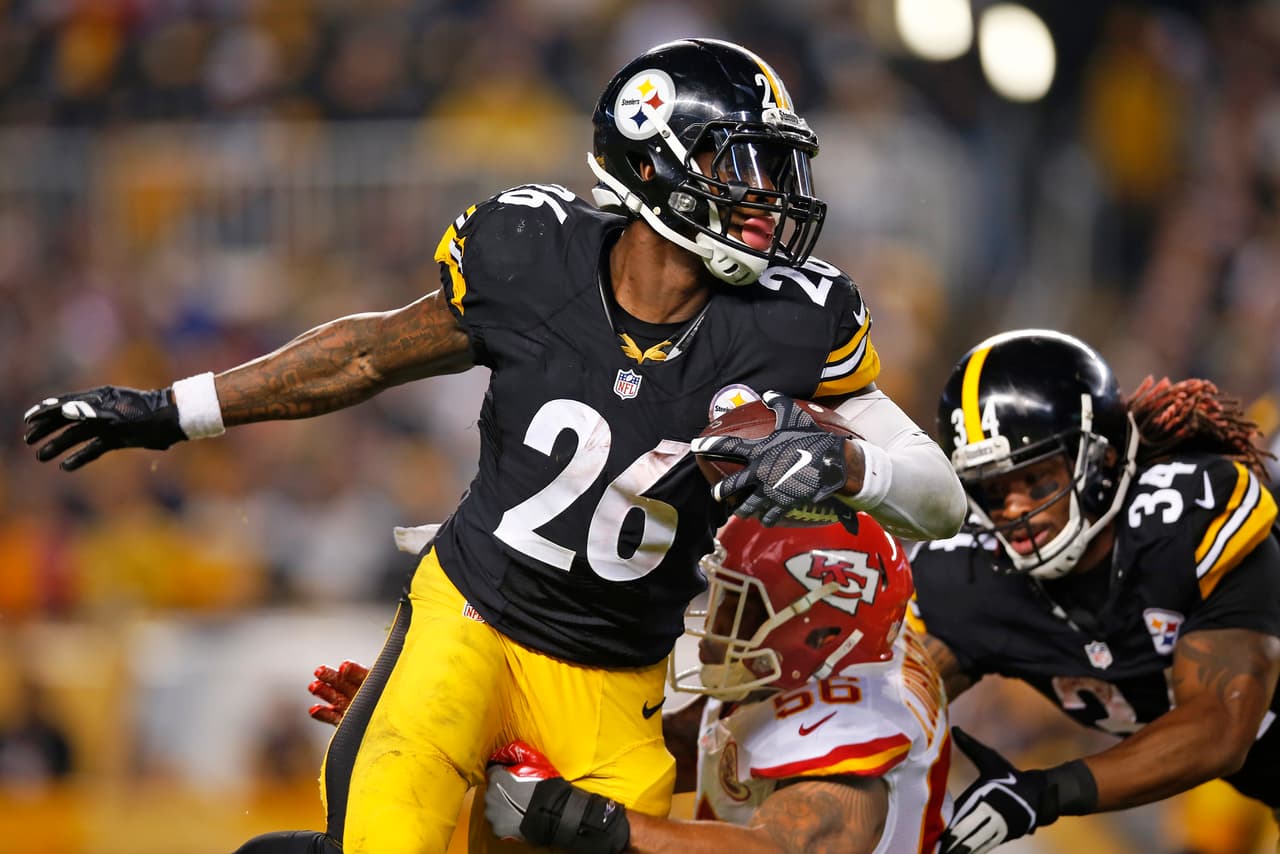 Pittsburgh Steelers running back Le'Veon Bell (26) is tackled by Kansas City Chiefs inside linebacker Derrick Johnson (56) during the first half of an NFL football game in Pittsburgh, Sunday, Oct. 2, 2016. (AP Photo/Jared Wickerham)