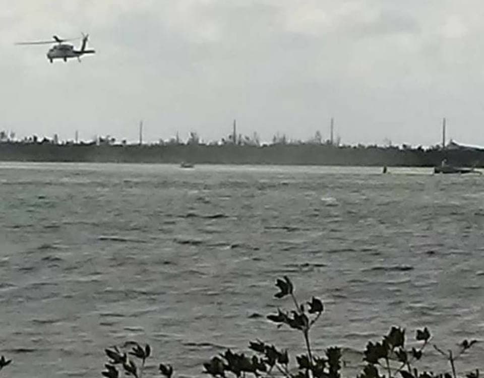 REFILE - CORRECTING TYPO IN BYLINE A rescue helicopter hovers above a U.S. Navy jet after it crashed near Naval Air Station Key West off the coast the Florida Keys, in this picture taken from social media, March 14, 2018. Justin Duane/via REUTERS THIS IMAGE HAS BEEN SUPPLIED BY A THIRD PARTY. MANDATORY CREDIT. NO RESALES. NO ARCHIVES