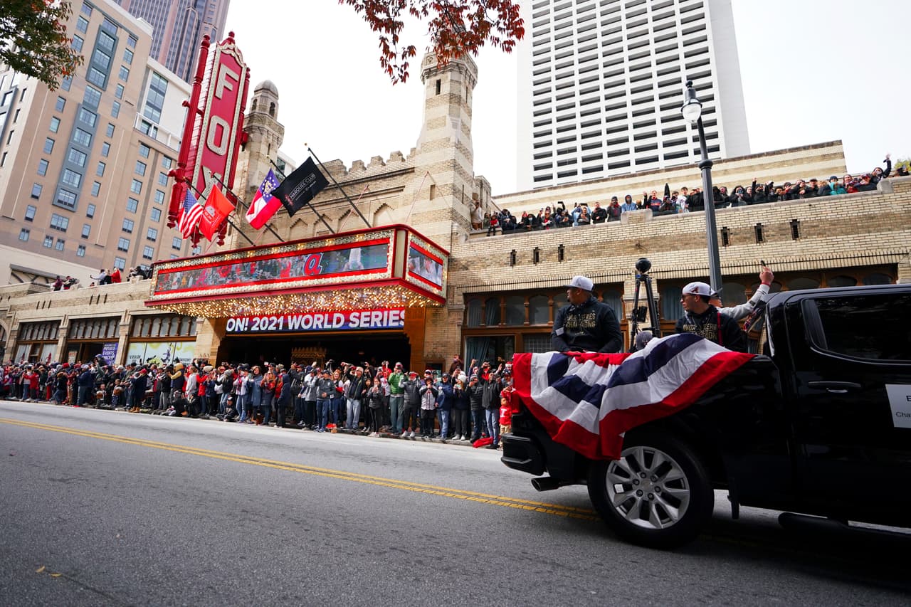 Atlanta Braves players celebrate the team's victory in front of the Fox Theatre during a victory parade, Friday, Nov. 5, 2021, in Atlanta. The Braves beat the Houston Astros 7-0 in Game 6 on Tuesday to win their first World Series baseball title in 26 years. (AP Photo/Brynn Anderson)