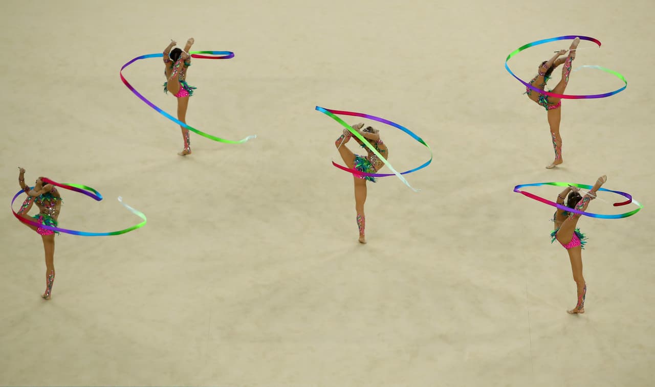 RIO DE JANEIRO, BRAZIL - AUGUST 21: Vera Biriukova, Anastasia Bliznyuk, Anastasiia Maksimova, Anastasiia Tatareva and Maria Tolkacheva of Russia compete during the Group All-Around Final on Day 16 of the Rio 2016 Olympic Games at Rio Olympic Arena on August 21, 2016 in Rio de Janeiro, Brazil. (Photo by Clive Brunskill/Getty Images)