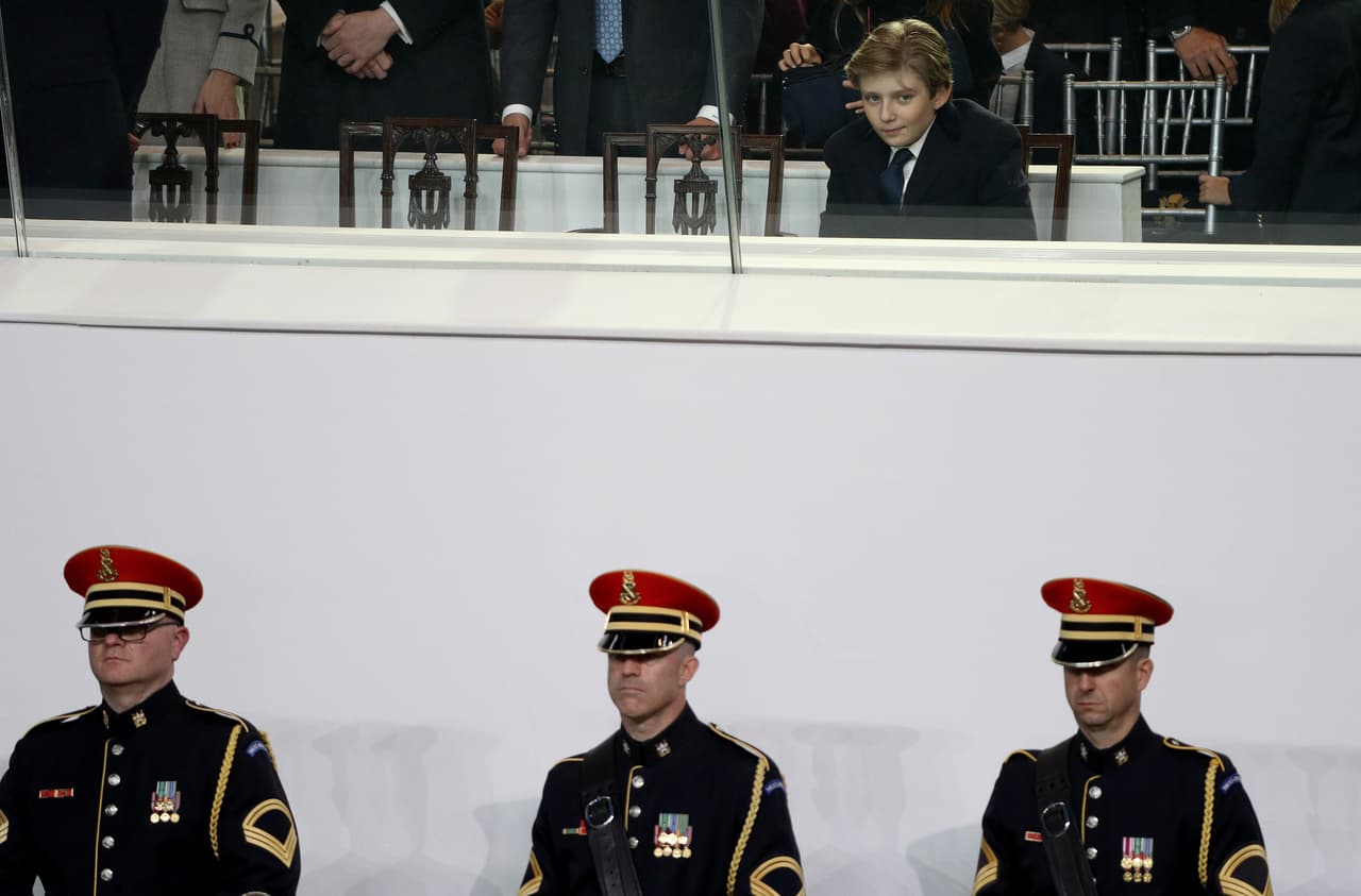 WASHINGTON, DC - JANUARY 20: Barron Trump watches the Inaugural Parade from the main reviewing stand in front of the White House on January 20, 2017 in Washington, DC. Donald J. Trump was sworn in today as the 45th president of the United States. (Photo by Patrick Smith/Getty Images)