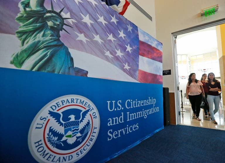 Immigrants arrive for a citizenship swearing in ceremony in Miami.