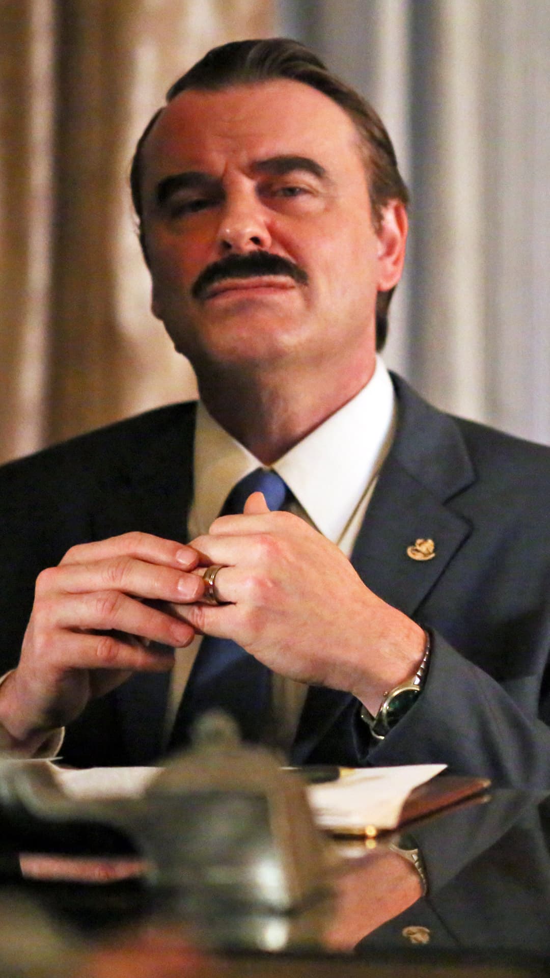 He first appears in Season 2 as the 59-year old leader of the “opposition party,” which has taken power away from the establishment party after 71 years.