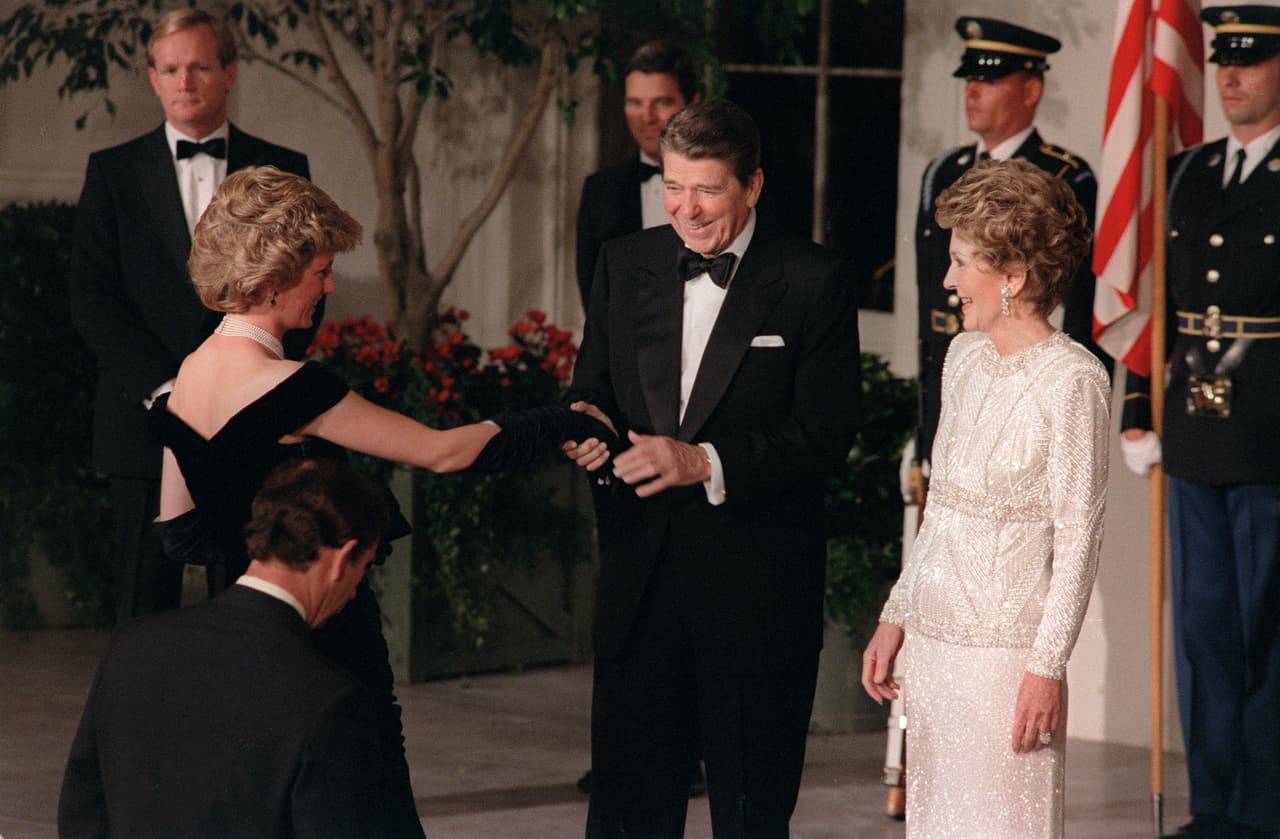 US President Ronald Reagan and his wife Nancy welcome 09 November 1985 in White House, Washington, D.C., Princess Diana and her husband Prince Charles (not in the picture). The Royal Couple arrive in Washington, D.C. for a three-day visit before traveling on to Florida. Britain's Prince Charles and his new bride, Camilla, arrive in the United States Tuesday 01 November 2005 on their first official trip overseas since their wedding in April. The eight-day visit to New York, Washington and San Francisco will include a wreath-laying ceremony at the site of the September 11, 2001 attacks on the World Trade Center, a meeting with UN Secretary General Kofi Annan, lunch and dinner at the White House and several receptions, as well as meetings with business leaders and organic farmers. AFP PHOTO DON RYPKA (Photo credit should read DON RYPKA/AFP/Getty Images)