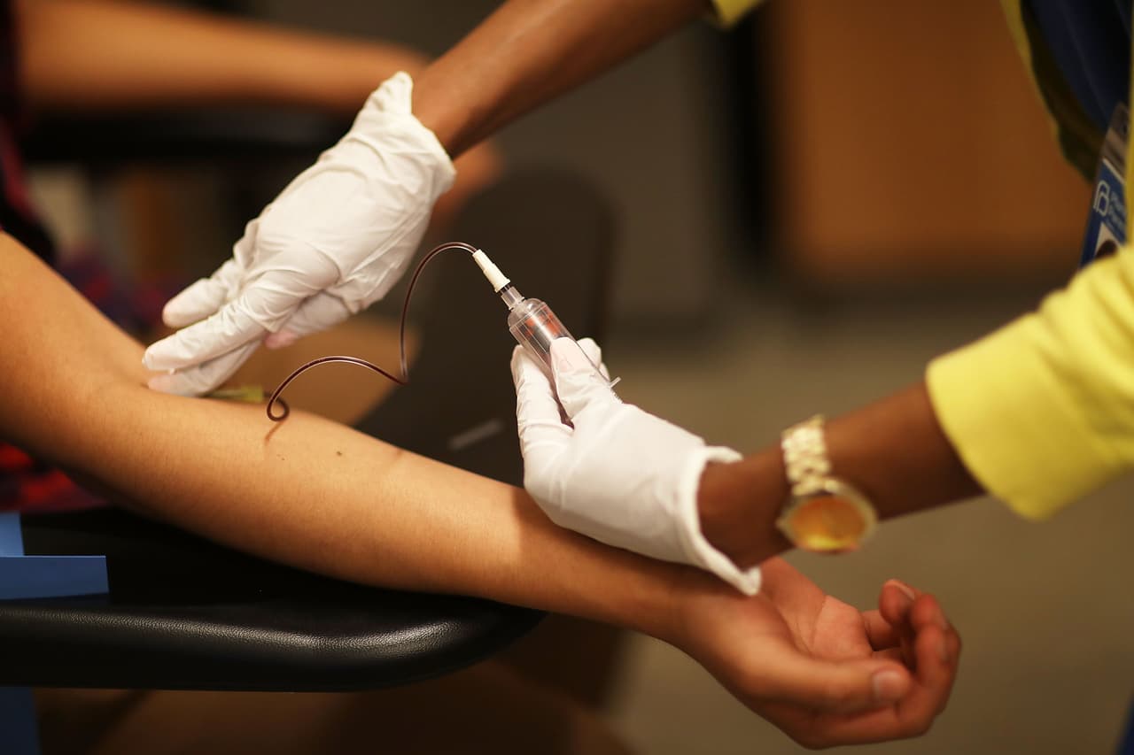 MIAMI, FL - MAY 12: Peter Yanez, who is insured under a policy from the Affordable Care Act, has blood drawn by Linda Williams, a medical assistant, as he gets a blood test at a Planned Parenthood health center on May 12, 2017 in Miami, Florida. A GOP plan to repeal the Affordable Care Act would cut federal funding for Planned Parenthood services at their health centers. Planned Parenthood has approximately 700 health centers across the country that serve 2,470,000 male and female patients and provide services for preventive health care, birth-control, cancer screeening, pregnancy tests and STD testing and treatment. (Photo by Joe Raedle/Getty Images)