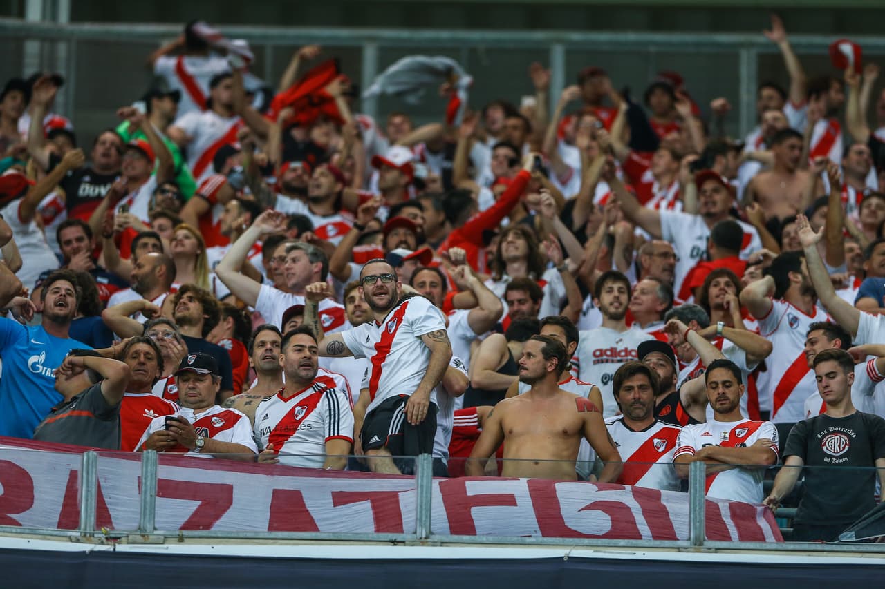PORTO ALEGRE, BRAZIL - OCTOBER 30: River Plate fans cheer for their team before the match between Gremio and River Plate as part of Copa Conmebol Libertadores 2018 at Arena do Gremio on October 30, 2018, in Porto Alegre, Brazil. (Photo by Lucas Uebel/Getty Images)