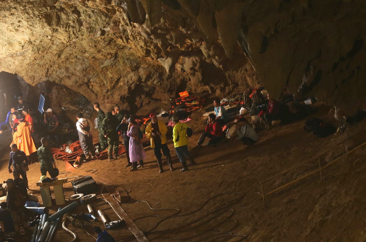 Emergency rescue teams gather in the staging area as they continue the search for 12 young soccer team members and their coach after going missing in a large cave in Mae Sai, Chiang Rai province, in northern Thailand Wednesday, June 27, 2018. Rain is continuing to fall and water levels keep rising inside a cave in northern Thailand, frustrating the search for 12 boys and their soccer coach who have been missing since Saturday. (AP Photo/Sakchai Lalit)