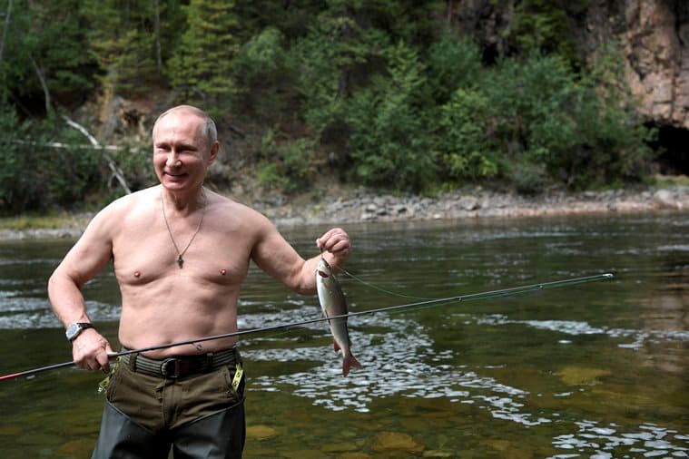 Tyva : In this photo released by Kremlin press service on Saturday, Aug. 5, 2017, Russian President Vladimir Putin holds a fish he caught during a mini-break in the Siberian Tyva region a few days ago. AP/PTI(AP8_5_2017_000027B)