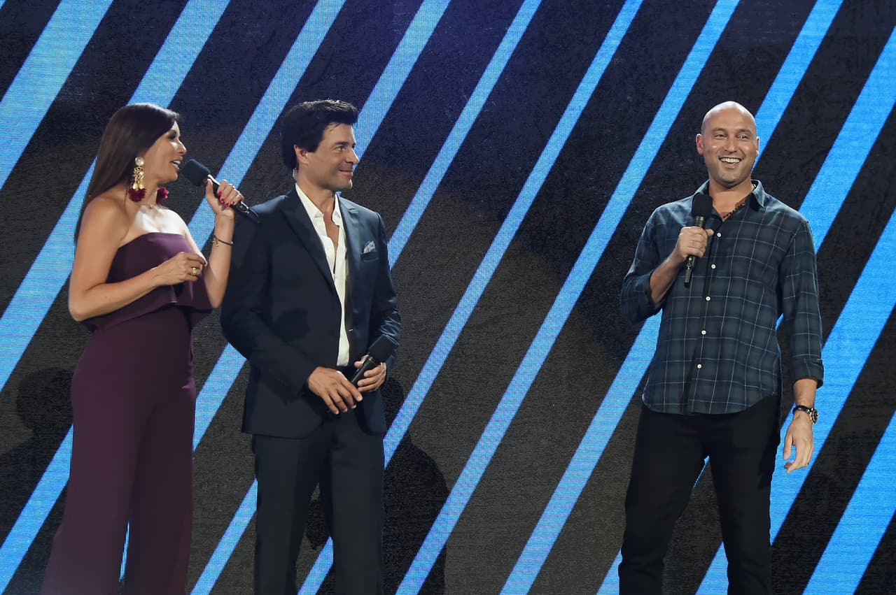 MIAMI, FL - OCTOBER 14: In this handout photo provided by One Voice: Somos Live!, Giselle Blondet, Chayanne and Derek Jeter speak onstage at One Voice: Somos Live! A Concert For Disaster Relief at Marlins Park on October 14, 2017 in Miami, Florida. (Photo by Rick Diamond/One Voice: Somos Live!/Getty Images)
