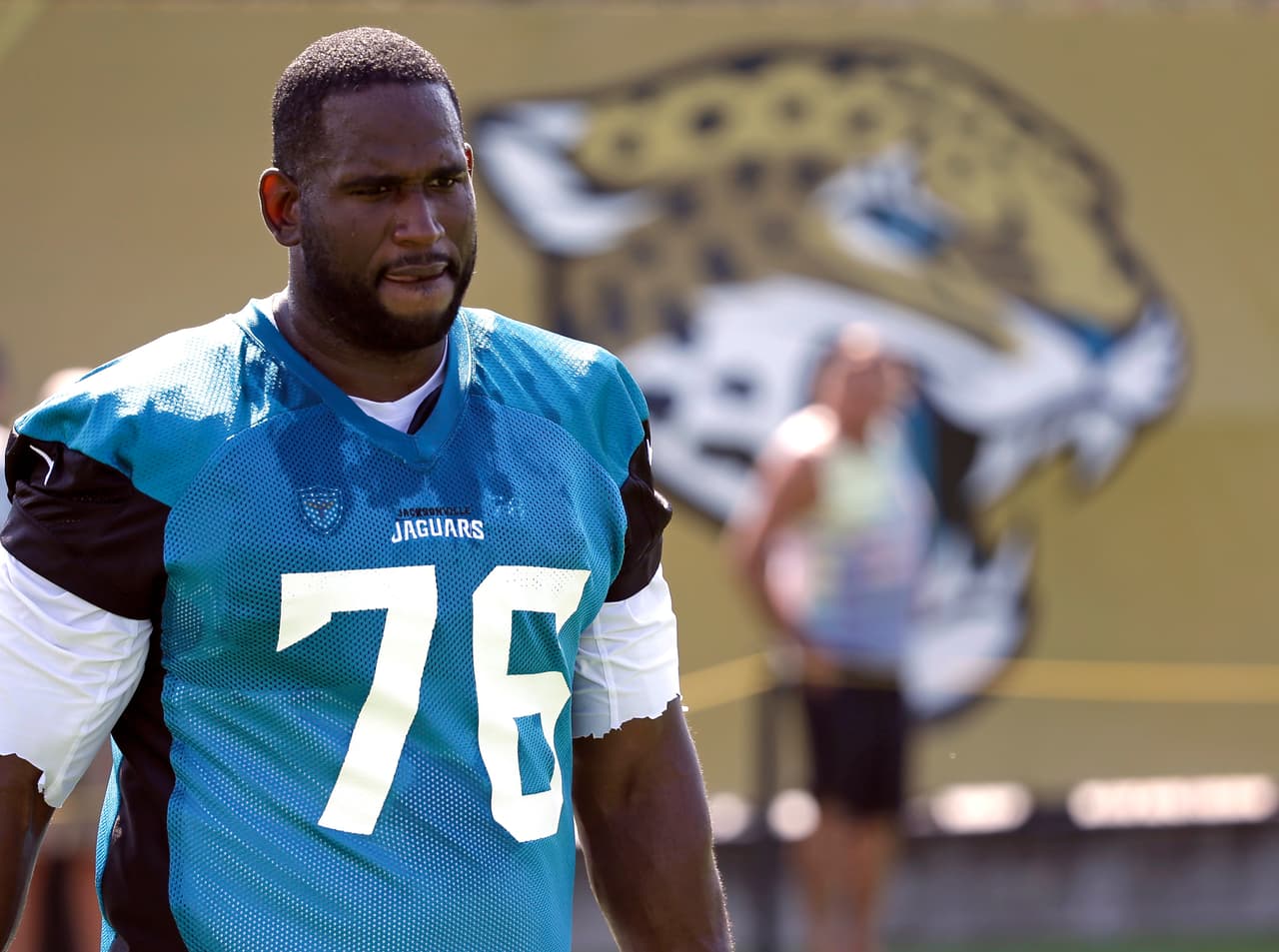FILE - In this July 28, 2017, file photo, Jacksonville Jaguars offensive lineman Branden Albert (76) arrives at practice during NFL football training camp, in Jacksonville, Fla. Branden Albert has abruptly retired. The two-time Pro Bowl selection was acquired in a trade with the Miami Dolphins in March. He called it quits at age 32 Monday, July 31, 2017, after three days of training camp and nine NFL seasons. (AP Photo/John Raoux, File)