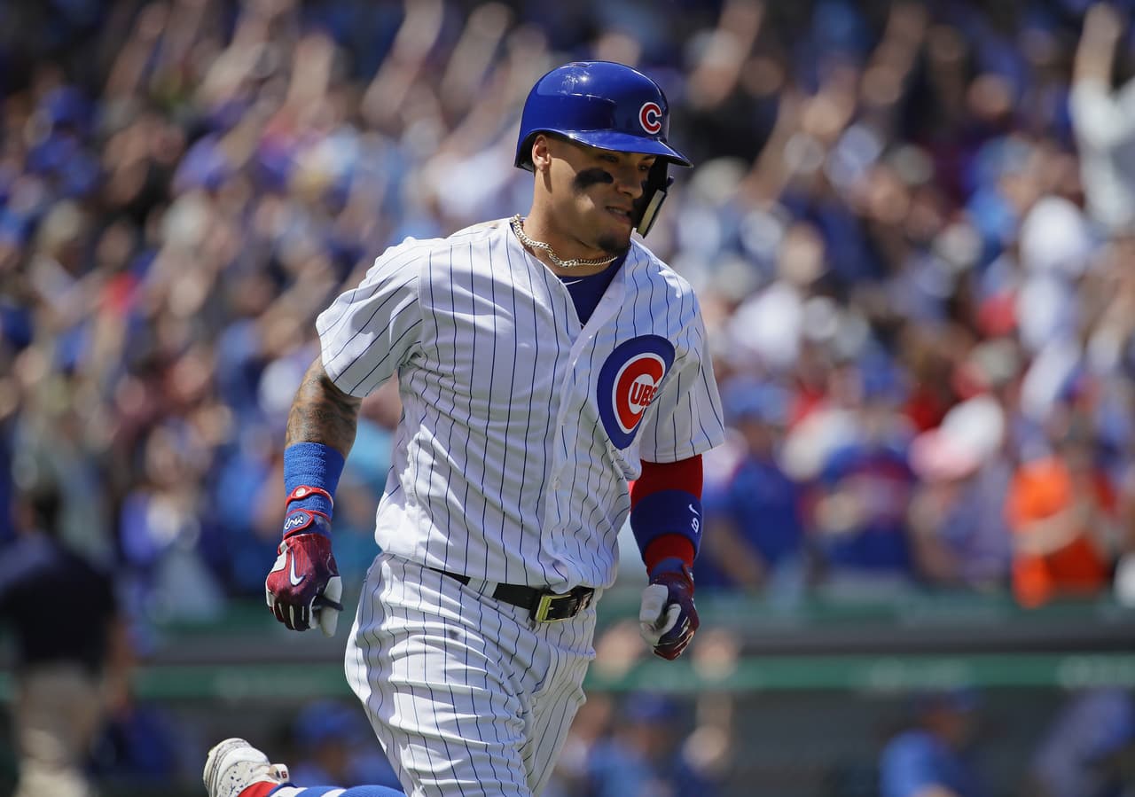 CHICAGO, IL - MAY 18: Javier Baez #9 of the Chicago Cubs runs the bases after hitting a grand slam home run in the 1st inning against the Cincinnati Reds at Wrigley Field on May 18, 2017 in Chicago, Illinois. (Photo by Jonathan Daniel/Getty Images)