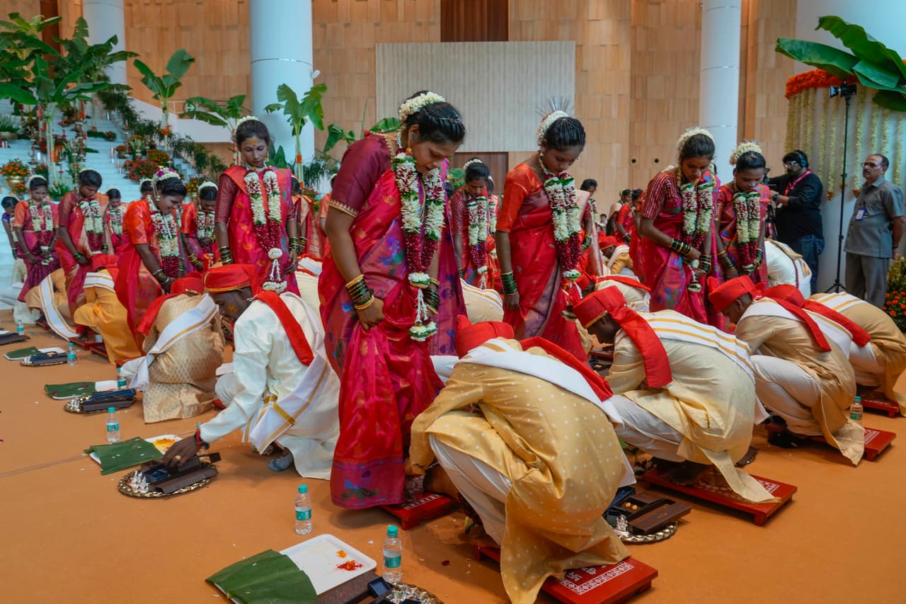 Underprivileged couples take part in a mass wedding organised by Chairman of Reliance Industries Limited Mukesh Ambani as the part of pre- wedding celebrations of his youngest son, Anant Ambani in Navi Mumbai, India, Tuesday, July 2, 2024. (AP Photo/Rafiq Maqbool)