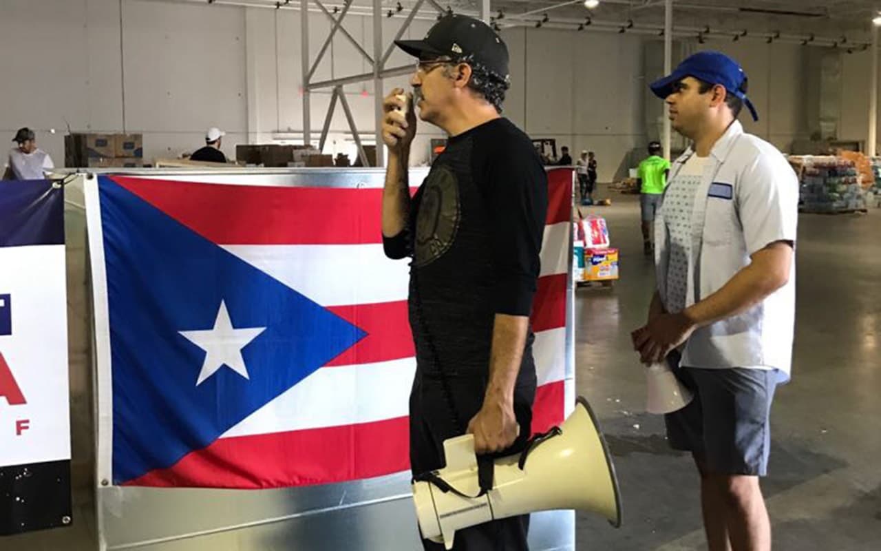 Cuban-American Albert Gomez is one of the organizers in Miami with
<a href="http://www.thirdwavevolunteers.com/">Third Wave Volunteers</a>, a disaster response group, together with the non-profit,
<a href="http://reachoutamerica.com/">Reach Out America.</a> Volunteers sorted aid supplies at a produciton facility, Mana Wynwood, in Miami's Wynwood arts district. Photo by Ines Lozano.