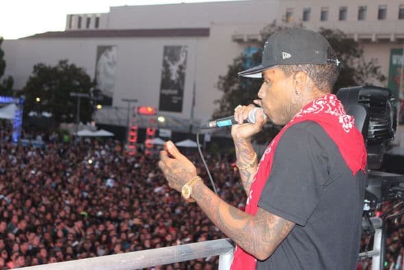 Kid Ink performed high above the crowd from the Coors Light stage! See exclusive pics of his high energy performance!