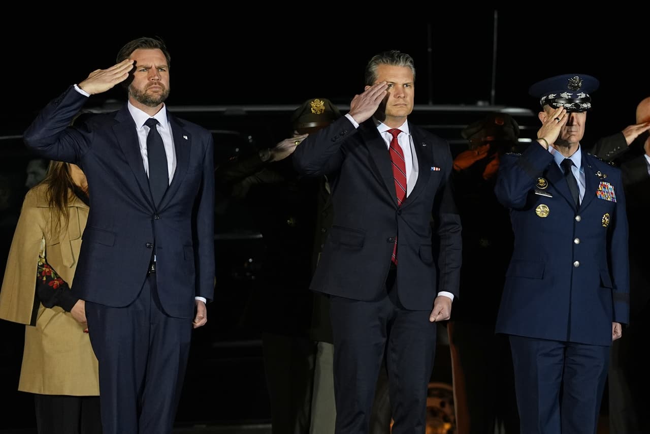 Vice President JD Vance, Defense Secretary Pete Hegseth and Chairman of the Joint Chiefs of Staff Gen. Dan Caine, salute during a dignified transfer for Sgt. Benjamin N. Pennington, 26, of Glendale, Ky., Monday March 9, 2026, at Dover Air Force Base, Del. (AP Photo/Matt Rourke)