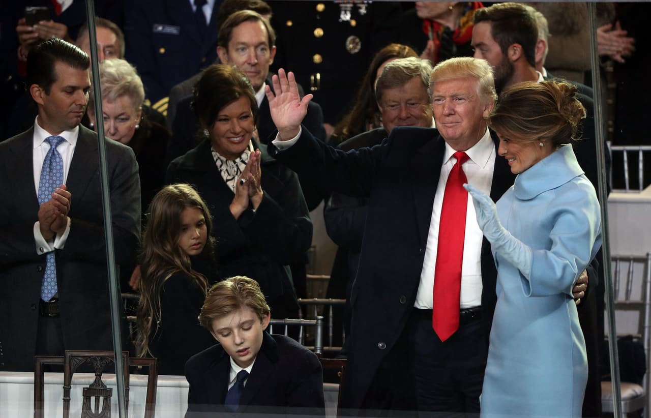 WASHINGTON, DC - JANUARY 20: (R-L) First lady Melania Trump, U.S. President Donald Trump and Barron Trump watch the Inaugural Parade from the main reviewing stand in front of the White House on January 20, 2017 in Washington, DC. Donald J. Trump was sworn in today as the 45th president of the United States. (Photo by Patrick Smith/Getty Images)