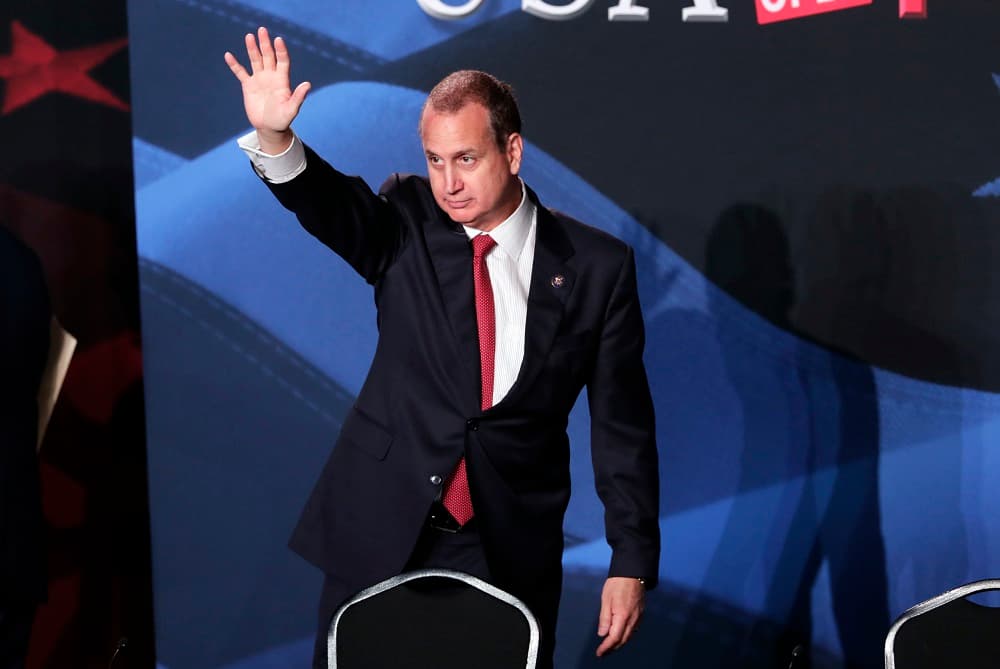 Mario Diaz-Balart, R-Fla., waves as he leaves a roundtable discussion on tax cuts for Florida small businesses attended by President Donald Trump, in Hialeah, Fla. (AP Photo/Lynne Sladky)