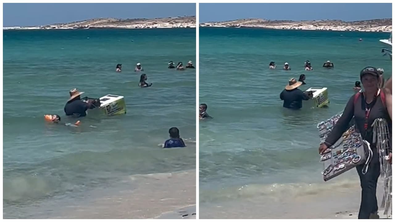 Mexicano lucha contra las olas para vender helados dentro del mar con todo y carrito