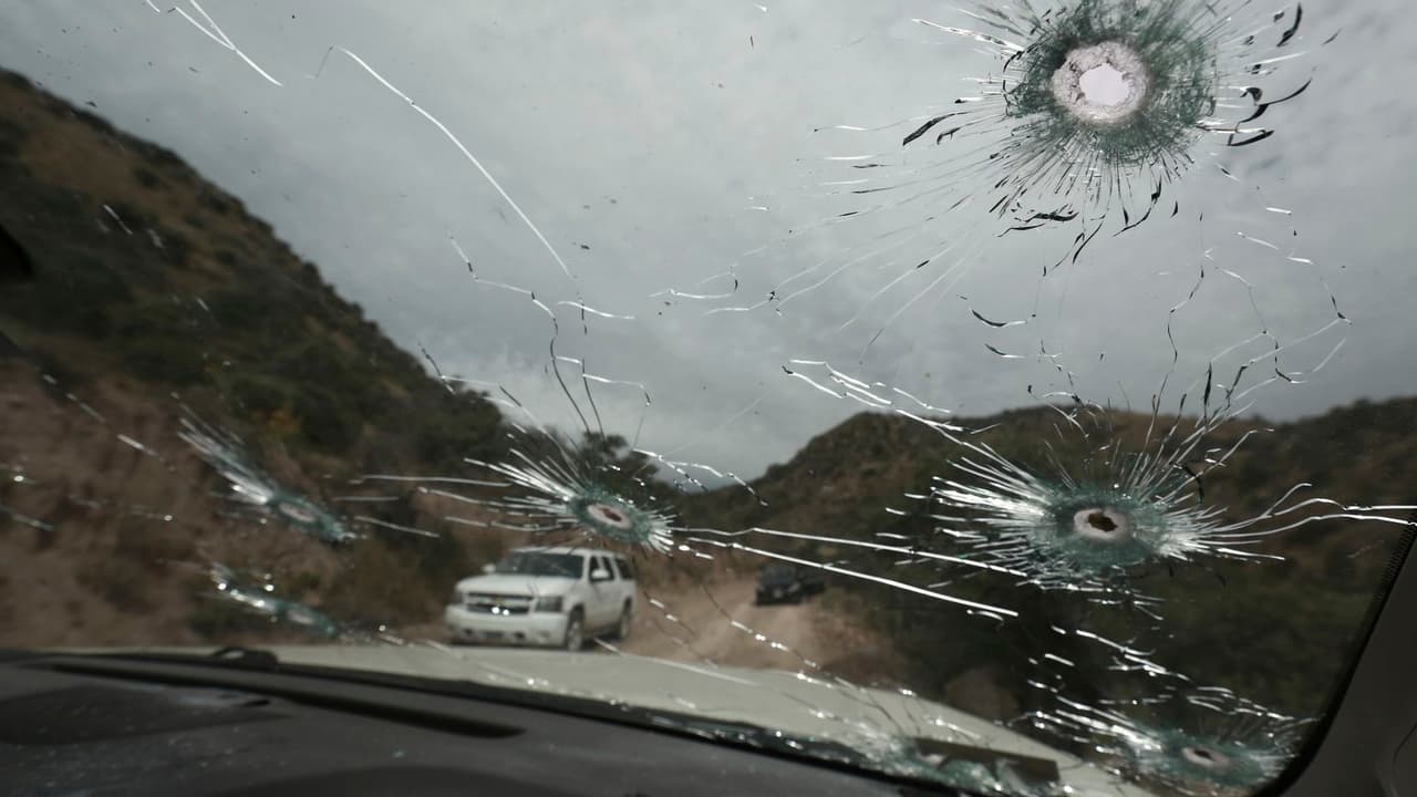 Bullet-riddled vehicles that members of the LeBaron family were traveling in sit parked on a dirt road near Bavispe, at the Sonora-Chihuahua border, Mexico, Nov 6, 2019.
