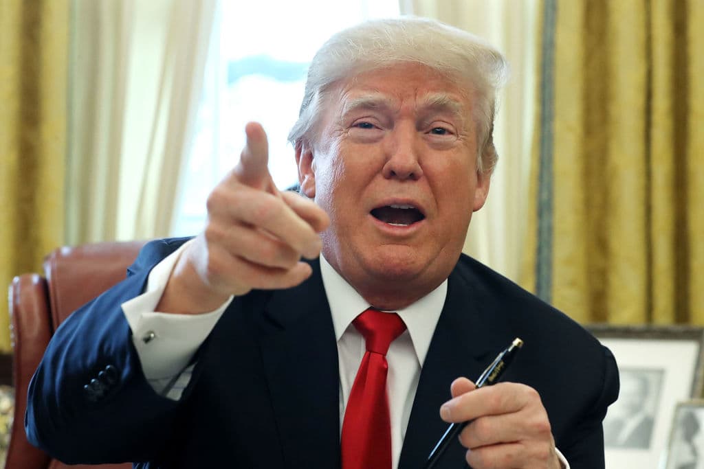 WASHINGTON, DC - DECEMBER 22: U.S. President Donald Trump talks with journalists after signing tax reform legislation into law in the Oval Office December 22, 2017 in Washington, DC. Trump praised Republican leaders in Congress for all their work on the biggest tax overhaul in decades. (Photo by Chip Somodevilla/Getty Images)