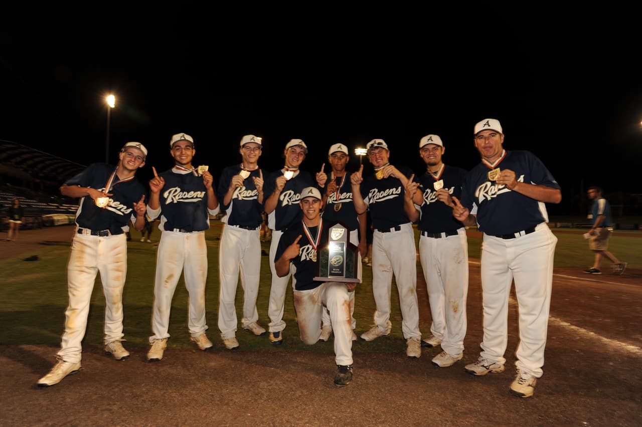 Jose (kneeling) with the 2011 State Champions, Tampa's Alonso High. The team with coach Landy Faedo (far right).