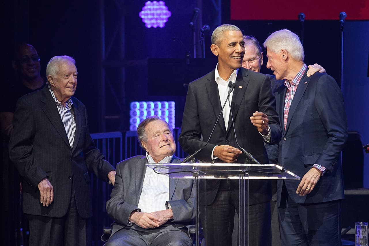 COLLEGE STATION, TX - OCTOBER 21: (L-R) Former United States Presidents Jimmy Carter, George H.W. Bush, Barack Obama, George W. Bush, and Bill Clinton address the audience during the 'Deep from the Heart: The One America Appeal Concert' at Reed Arena on the campus of Texas A&M University on October 21, 2017 in College Station, Texas. (Photo by Rick Kern/Getty Images for Ford Motor Company)