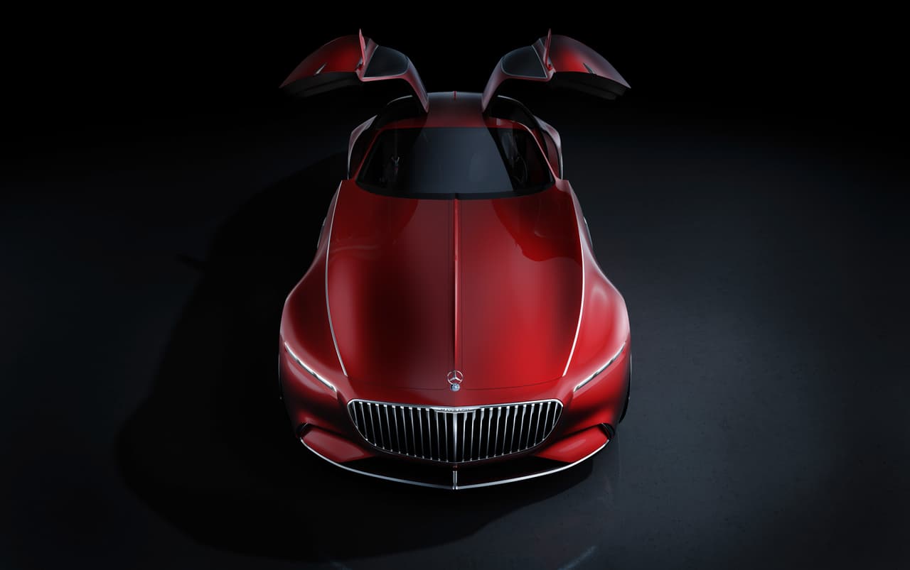 La puertas tipo '
<b>alas de gaviota</b>' del 
<b>Vision Mercedes-Maybach 6 Concept </b>son muy necesarias dada la portentosa longitud del vehículo. Extraña ver a la estrella de tres puntas de 
<b>Mercedes-Benz </b>sobre una parrilla de múltiples rayos verticales después de casi 100 años viéndola sobre parrillas con temas horizontales y cuadriculados. Toso pasa, todo se acaba y todo se olvida.
