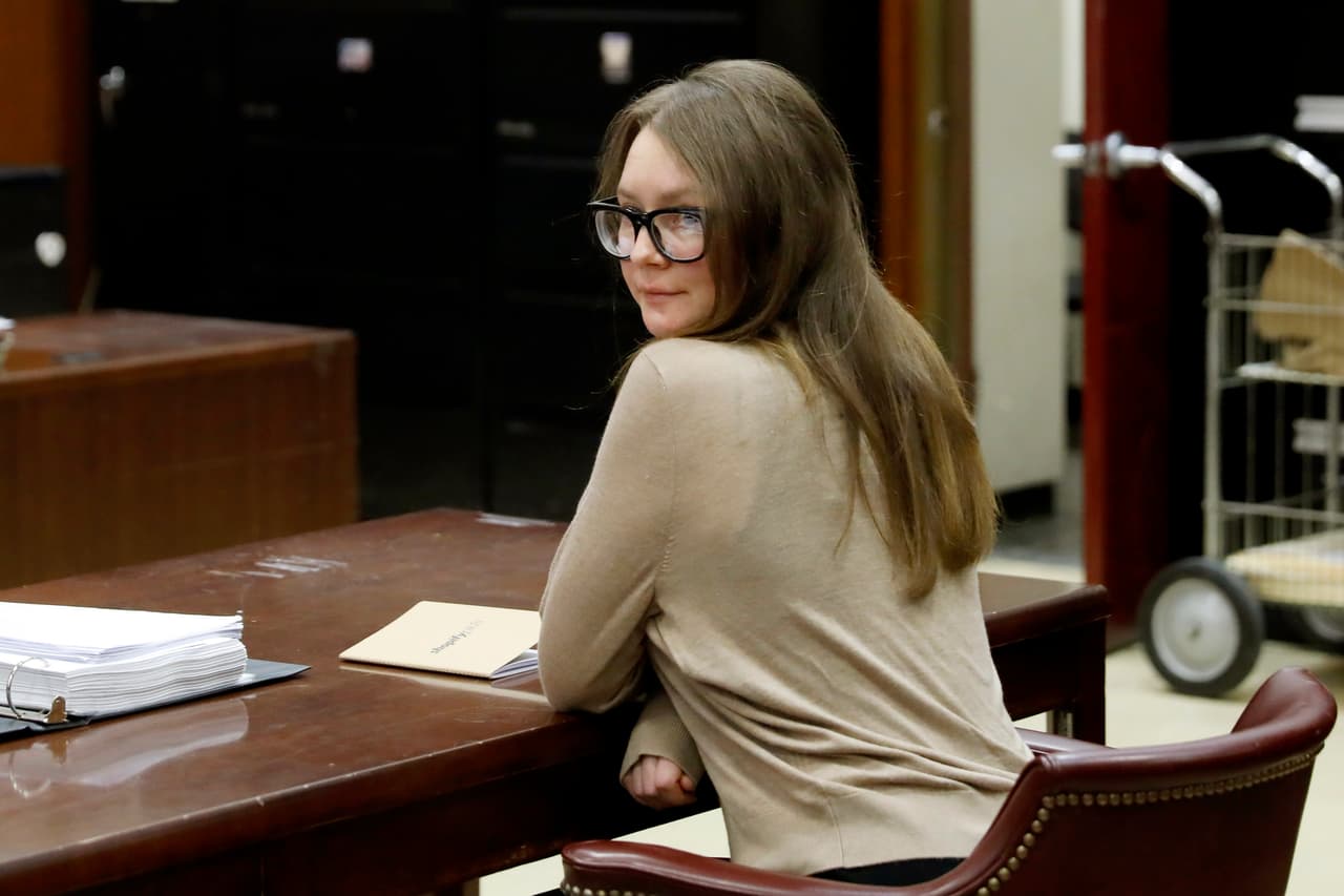 Anna Sorokin sits at the defense table in New York State Supreme Court, in New York, Wednesday, March 27, 2019. She is on trial on grand larceny and theft of services charges alleging she swindled $275,000 in a 10-month odyssey that saw her jetting to Omaha and Marrakesh. (AP Photo/Richard Drew)