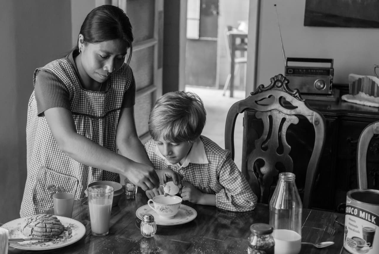 Yalitza Aparicio as Cleo and Marco Graf as Pepe in Roma, written and directed by Alfonso Cuarón. Photo by Carlos Somonte