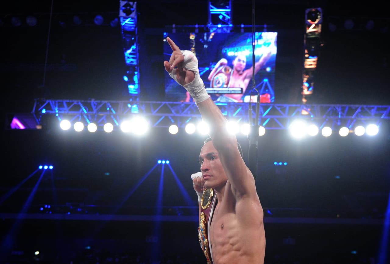 Mexico's Juan Francisco Estrada celebrates victory over Philippines' Milan Melindo after a WBO WBA flyweight title fight bout in Macau on July 27, 2013. Estrada defended his title by winning on a points decision. AFP PHOTO / Dale de la Rey (Photo credit should read DALE de la REY/AFP/Getty Images)
