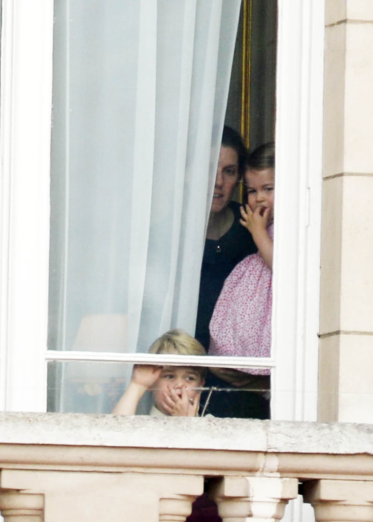 Prince George and Princess Charlotte and nanny Maria Teresa Turrion Borrallo watch the Queen return to Buckingham Palace at Trooping The Colour 2017