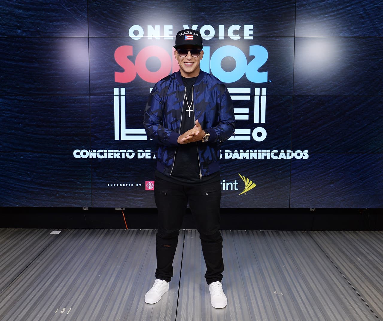 MIAMI, FL - OCTOBER 14: In this handout photo provided by One Voice: Somos Live!, Daddy Yankee poses in the pressroom at One Voice: Somos Live! A Concert For Disaster Relief at Marlins Park on October 14, 2017 in Miami, Florida. (Photo by Jason Koerner/One Voice: Somos Live!/Getty Images)