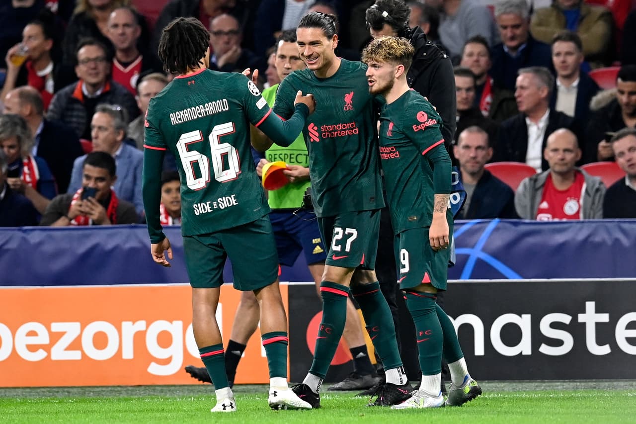 Liverpool's Uruguayan striker Darwin Nunez (C) celebrates scoring his team's second goal with teammates during the UEFA Champions League group A football match between Ajax Amsterdam and Liverpool at the Johan Cruijff ArenA in Amsterdam, on October 26, 2022. (Photo by JOHN THYS / AFP) (Photo by JOHN THYS/AFP via Getty Images)