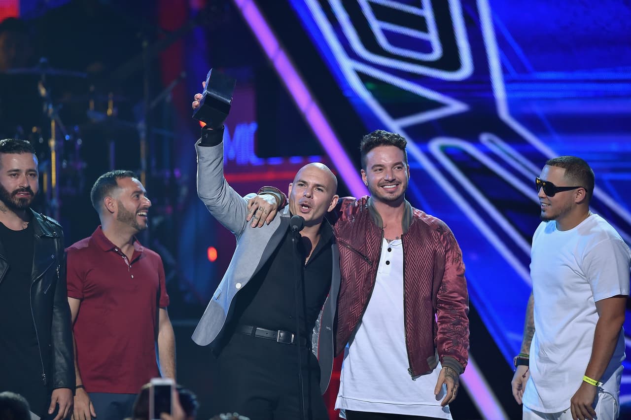 Pitbull and J Balvin accept an award onstage at Univision's Premios Juventud 2015 at Bank United Center on July 16, 2015 in Miami, Florida. The two worked together on the song 'Hey Ma' which appeared on the 'Fate of the Fuious' soundtrack.