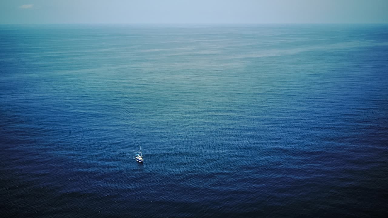 Drone shot of the Women on Waves boat in the open ocean.