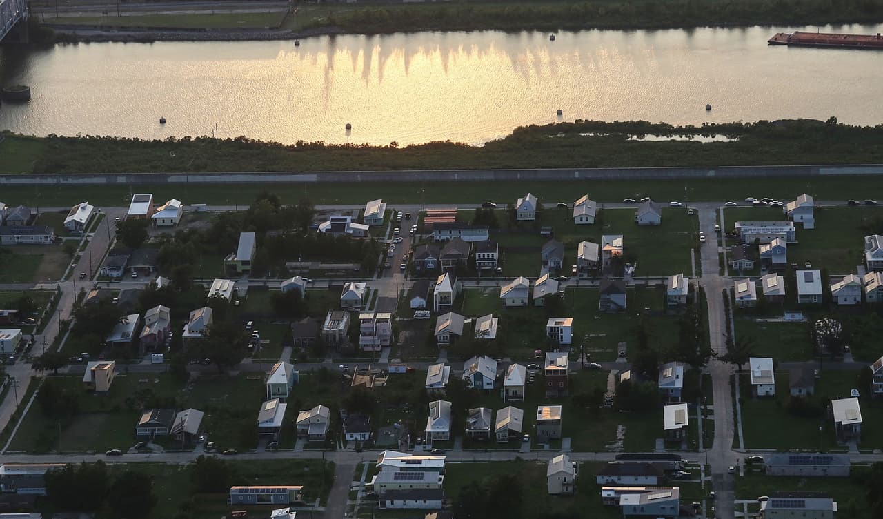 NEW ORLEANS, LA - AUGUST 24: New homes, many with solar panels constructed by the Make it Right Foundation, are mixed with old homes and vacant lots in the Lower Ninth Ward on August 24, 2015 in New Orleans, Louisiana. The area was one of the most heavily devastated areas of the city following a levee breach along the Industrial Canal during the aftermath of Hurricane Katrina. The tenth anniversary of Hurricane Katrina, which killed at least 1836 and is considered the costliest natural disaster in U.S. history, is August 29. (Photo by Mario Tama/Getty Images)
