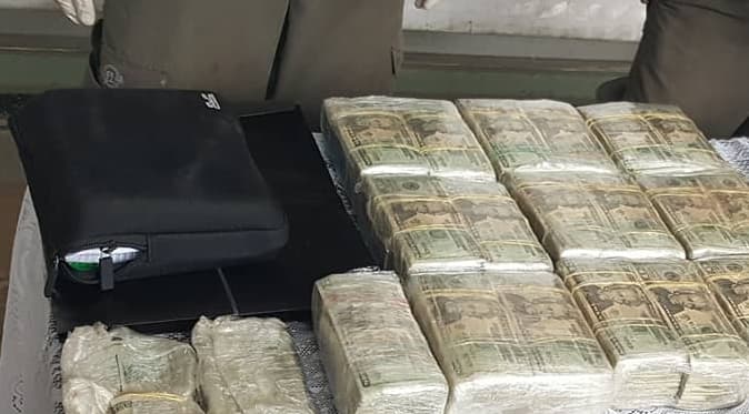 The spirals of the drug ledger notebooks are visible in a close up of the black case they were found in after police arrested Lopez Sanabria and found a hidden compartment under the car seat.