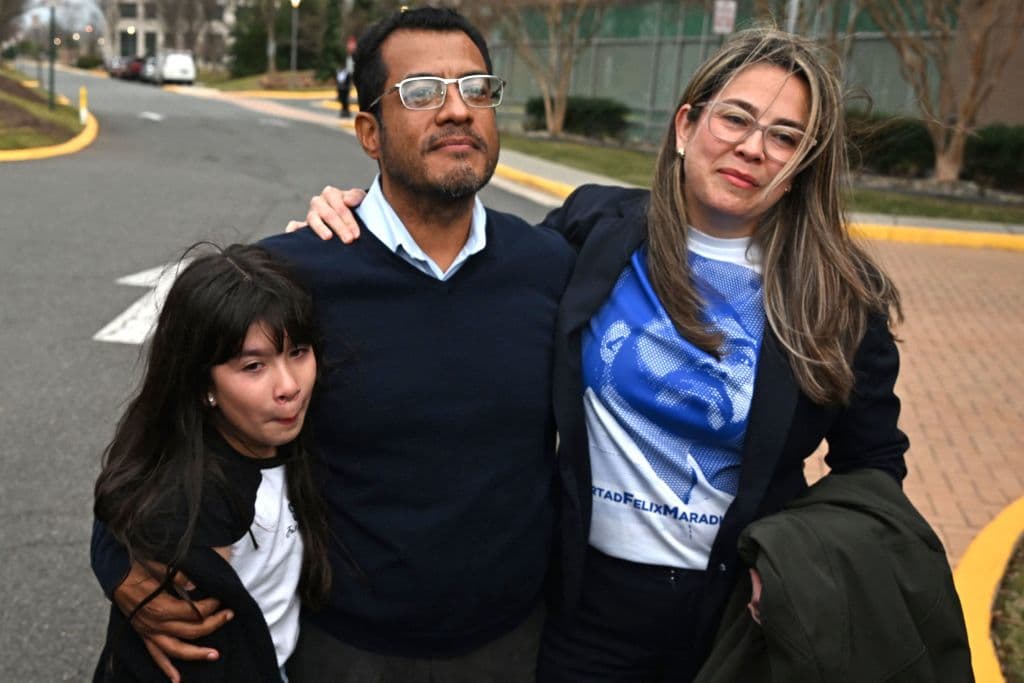 Nicaraguan scholar Felix Madariaga holds his daughter Alejandra,9, and his wife Berta Valle outside the Westin Hotel in Herndon, Virginia, on February 9, 2023.