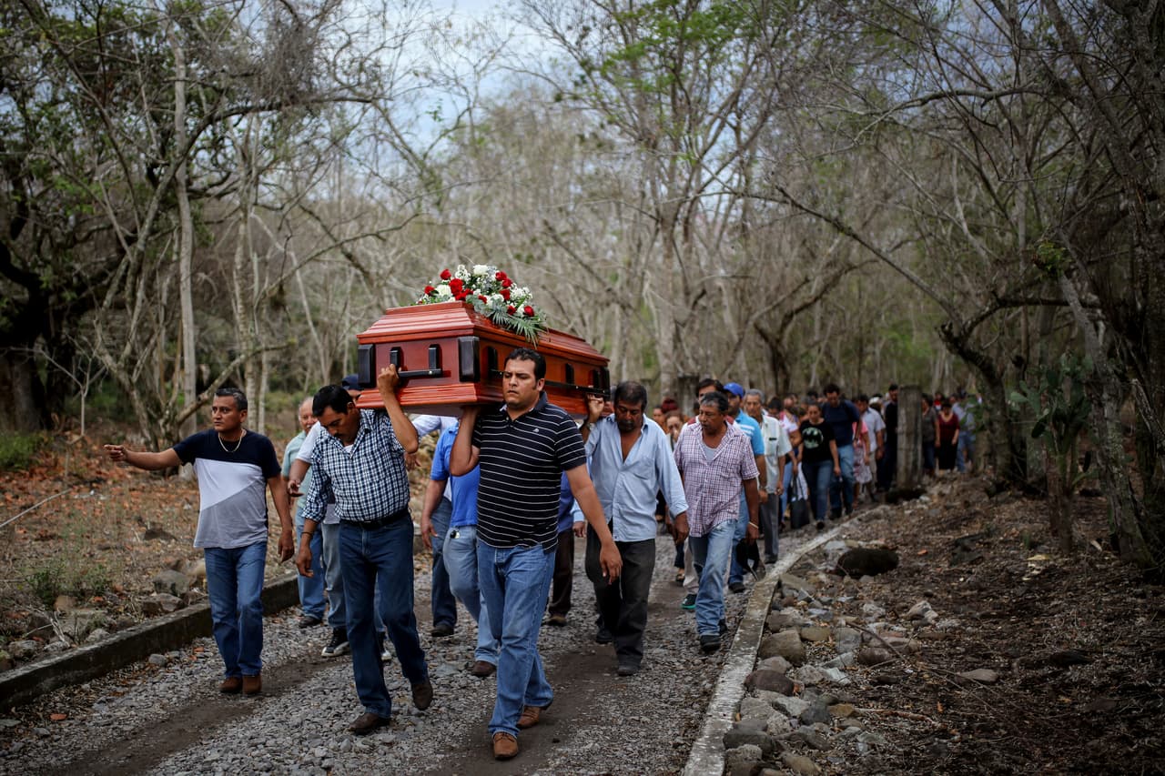 Colectivo Solecito says it's "the largest clandestine grave in Mexico and Latin America." In the photo, the body of Pedro Alberto Huesca is taken to the Palmas de Abajo cemetery in Veracruz on March 8, 2017.