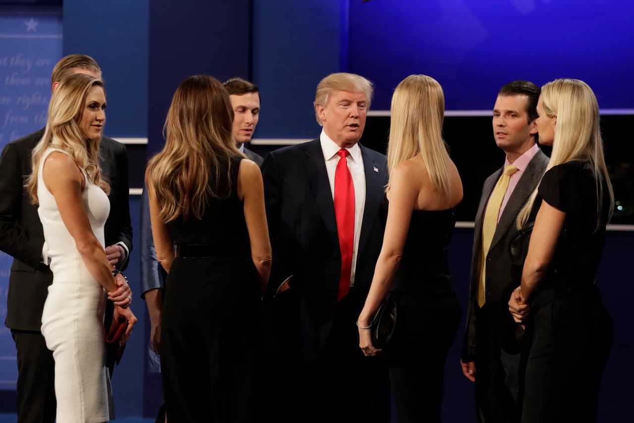 Republican presidential nominee Donald Trump speaks with his family on stage following the third presidential with Democratic presidential nominee Hillary Clinton debate at UNLV in Las Vegas, Wednesday, Oct. 19, 2016. (AP Photo/David Goldman)