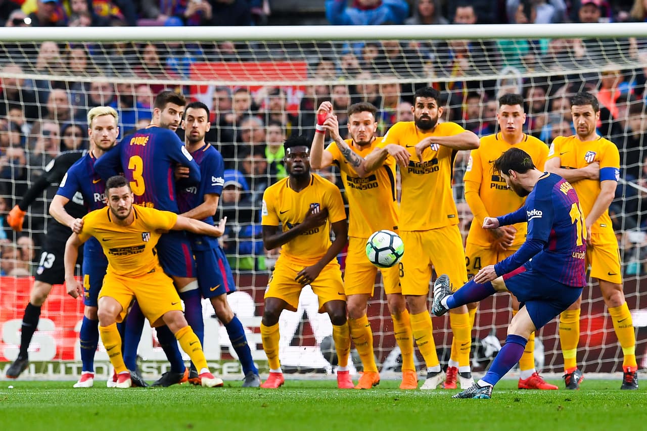 BARCELONA, SPAIN - MARCH 04: Lionel Messi of FC Barcelona scores the opening goal during the La Liga match between Barcelona and Atletico Madrid at Camp Nou on March 4, 2018 in Barcelona, Spain. (Photo by David Ramos/Getty Images)