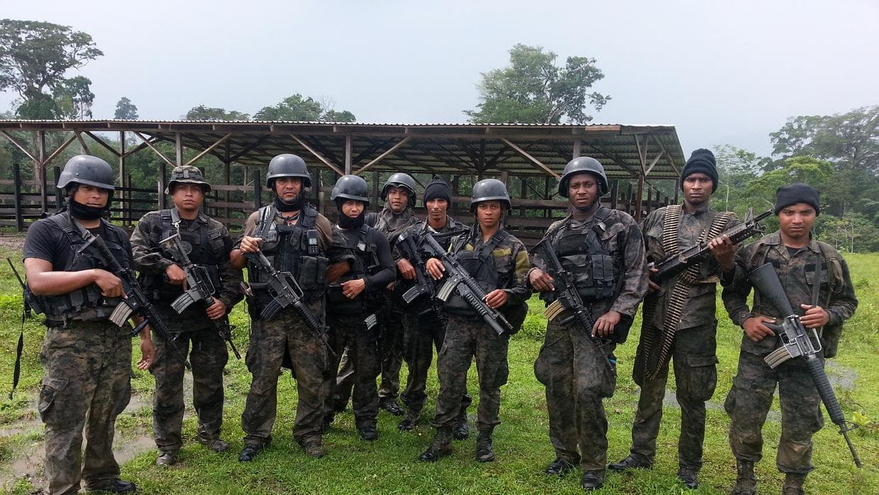 Rodriguez, third from left to right, with members of his military unit.